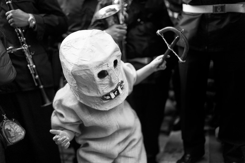 A young boy is dressed in his Devil costume in Prizzi, Sicily